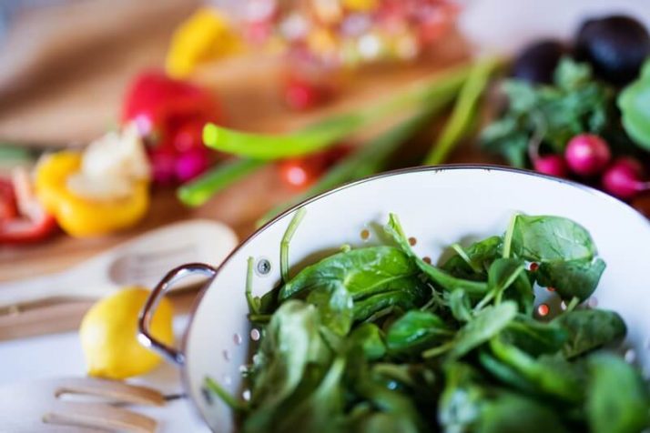 17 Surprising Spinach Nutrition Facts & Health Benefits; Fresh vegetables on the table, spinach & peppers