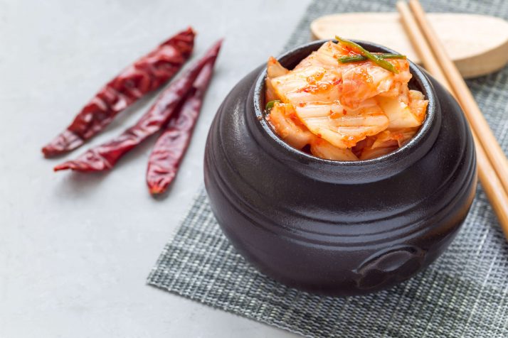 Kimchi cabbage. Korean appetizer in a ceramic jar, horizontal