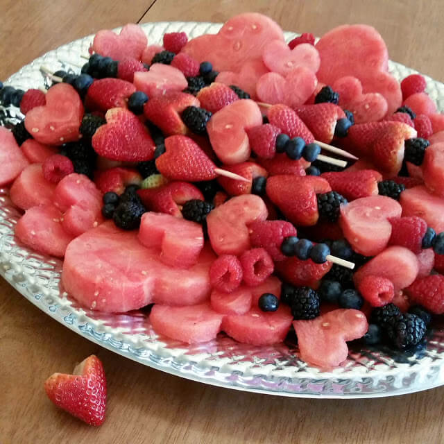 37 Healthy Valentine's Day Recipes: Indulge Without The Bulge
Valentine's Day Fruit Platter made with LOVE slices of watermelon strawberry, blackberry and blueberries