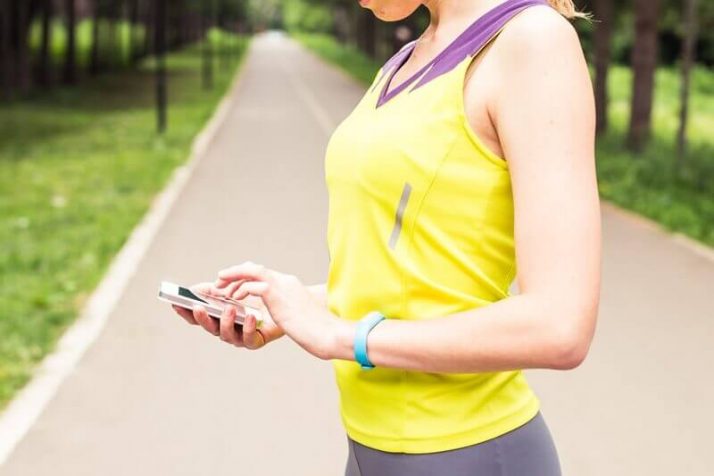 How Much Weight Can You Lose In A Month? (Truthfully) 
Woman checking fitness and health tracking wearable device