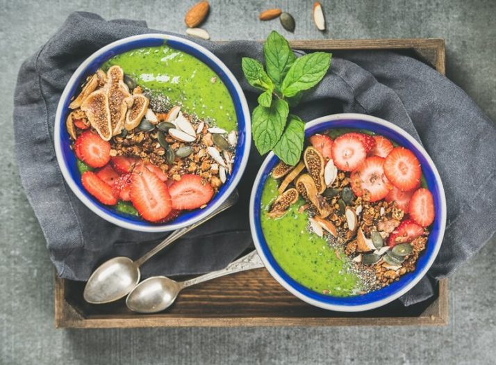 15 Green Smoothies For Weight Loss: Tasty, Fast & Healthy; Healthy green smoothie breakfast bowls with granola, fruit, seeds, berries