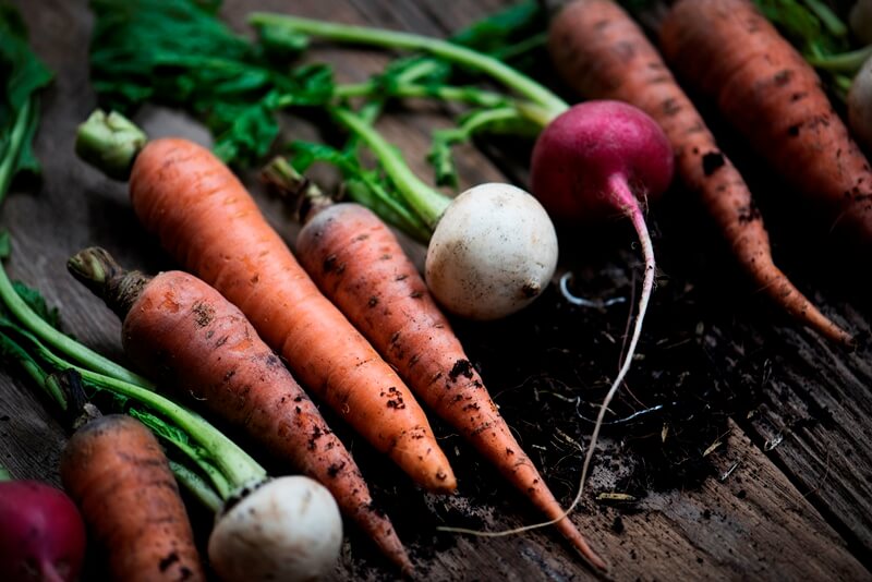 34 High Protein Vegetables You Probably Already Eat; carrots and beets on wooden table