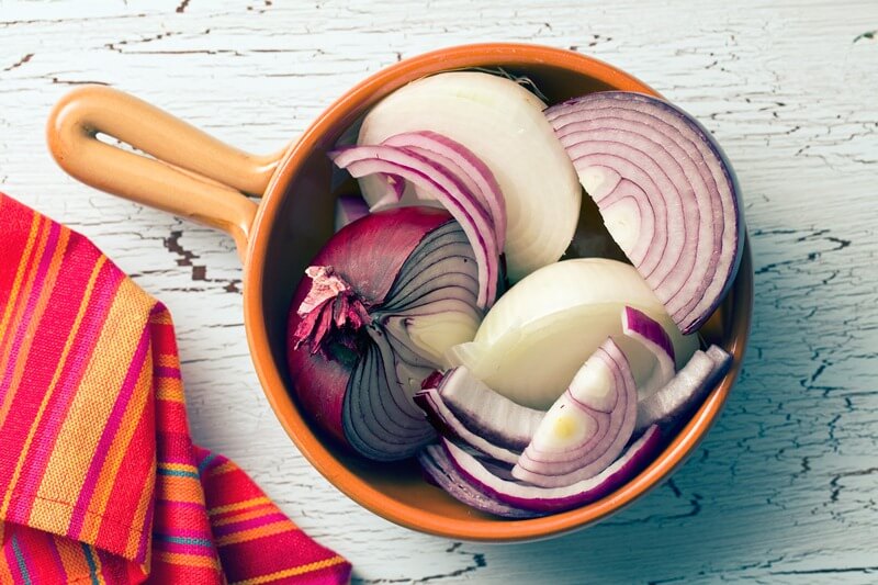 34 High Protein Vegetables You Probably Already Eat; chopped onions