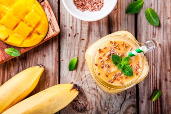 tropical smoothie made with mango, banana, flaxseed and mint