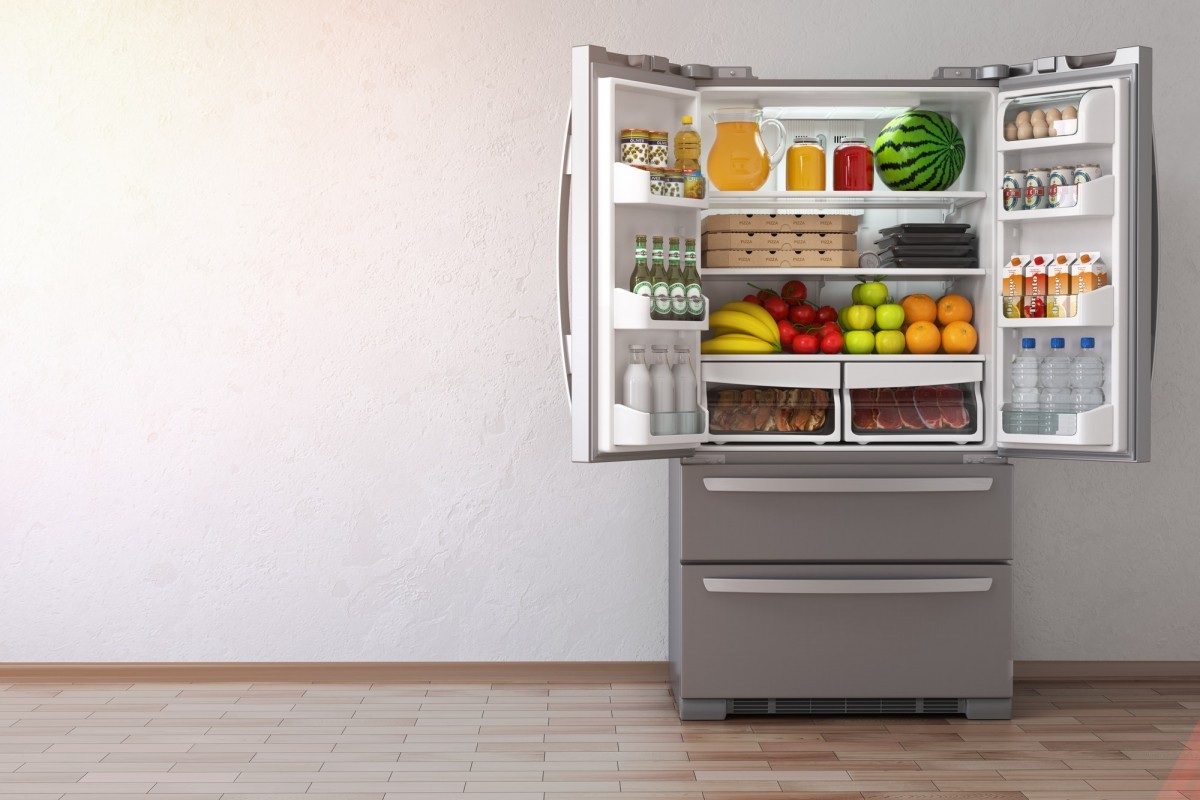 16 Best Smoothie Storage Solutions: My Smoothie Station Ideas; Open fridge refrigerator full of food in the empty kitchen inte