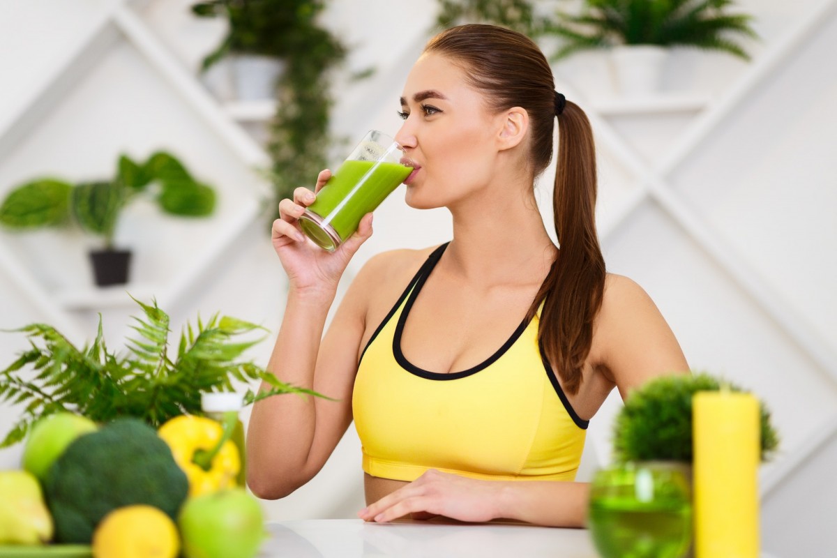Healthy Lifestyle. Slim Girl Drinking Smoothie After Training Healthy Lifestyle. Slim Girl Drinking Smoothie After Training
